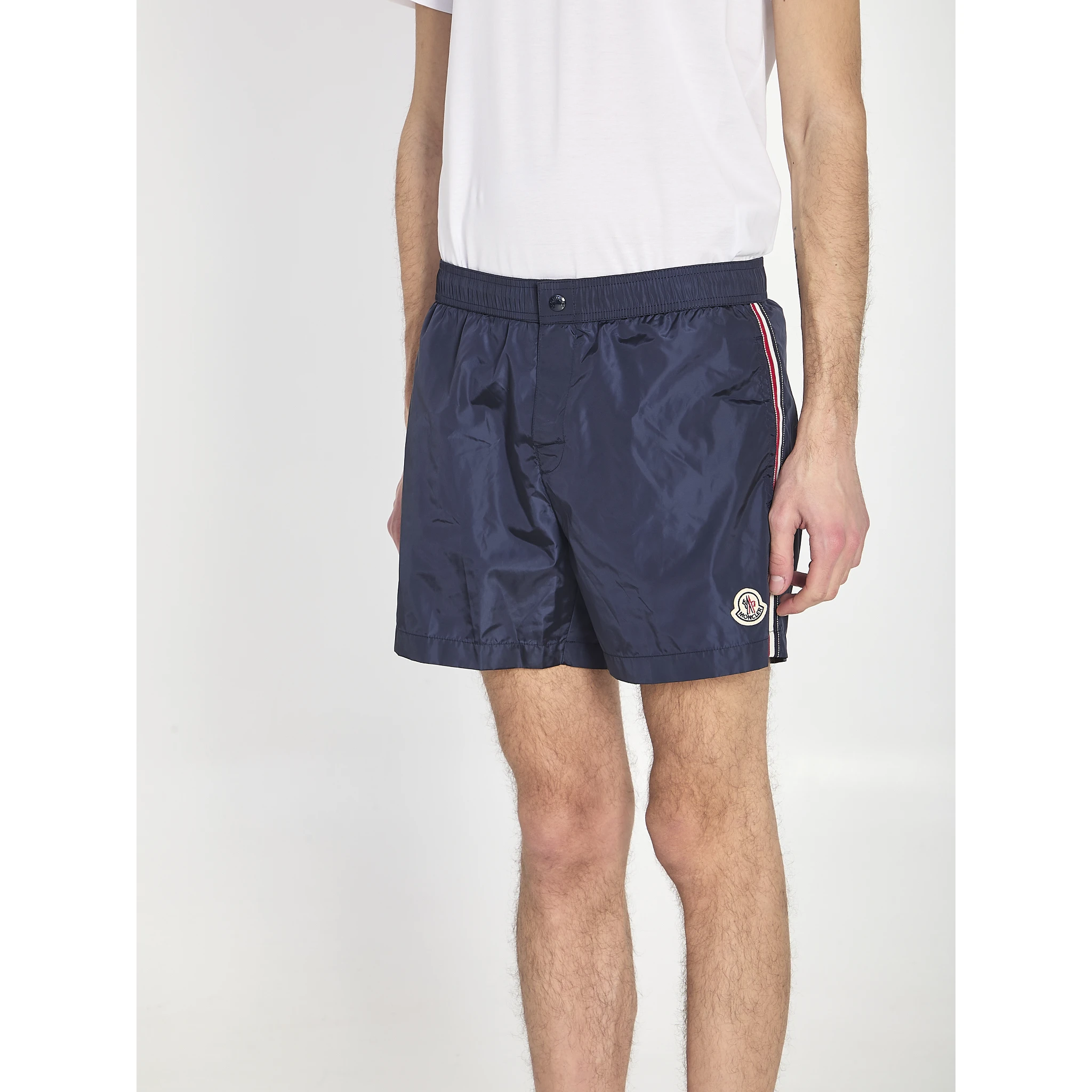 Swim shorts with a logo patch