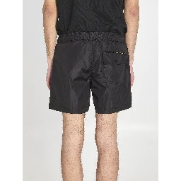 Swim shorts with a logo patch