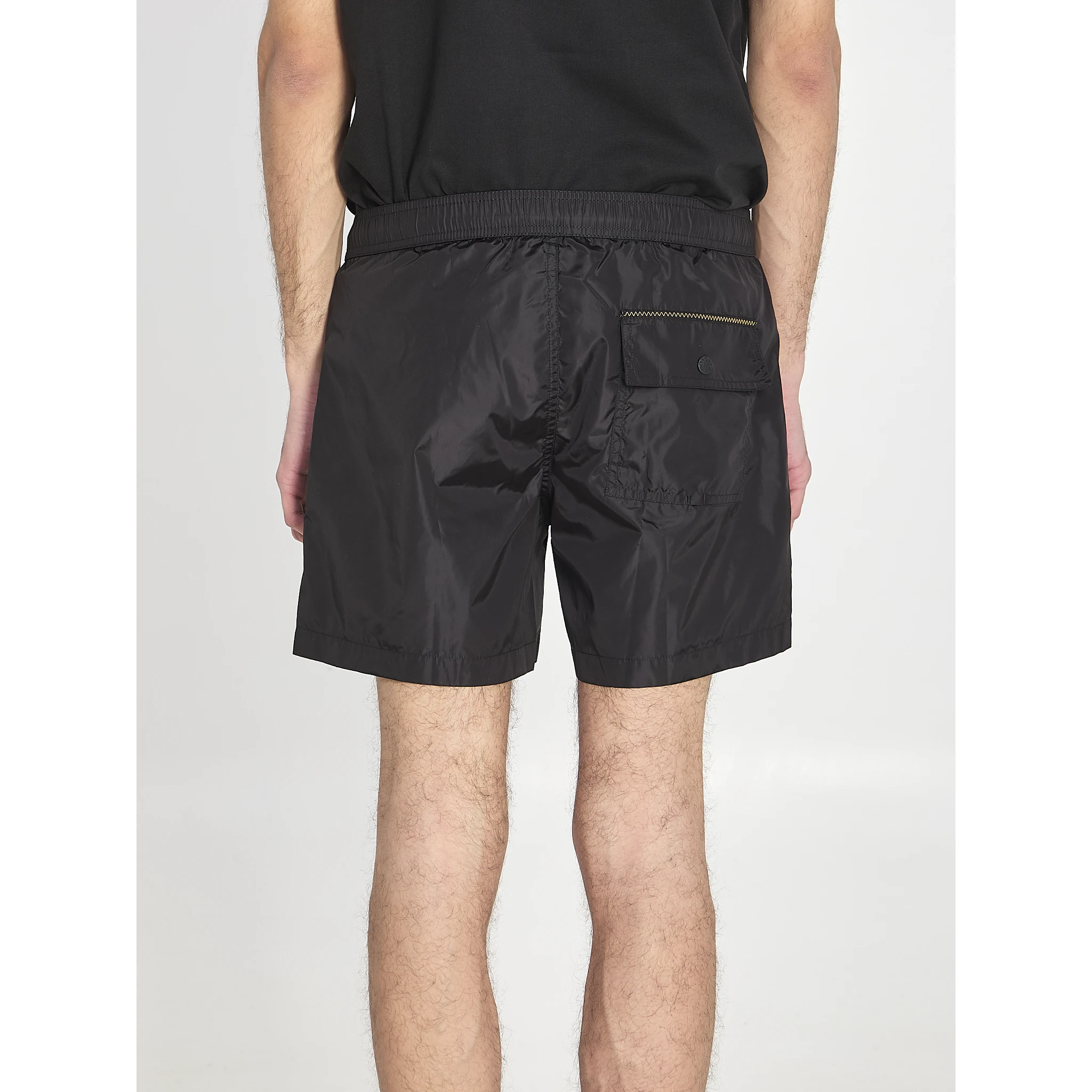 Swim shorts with a logo patch