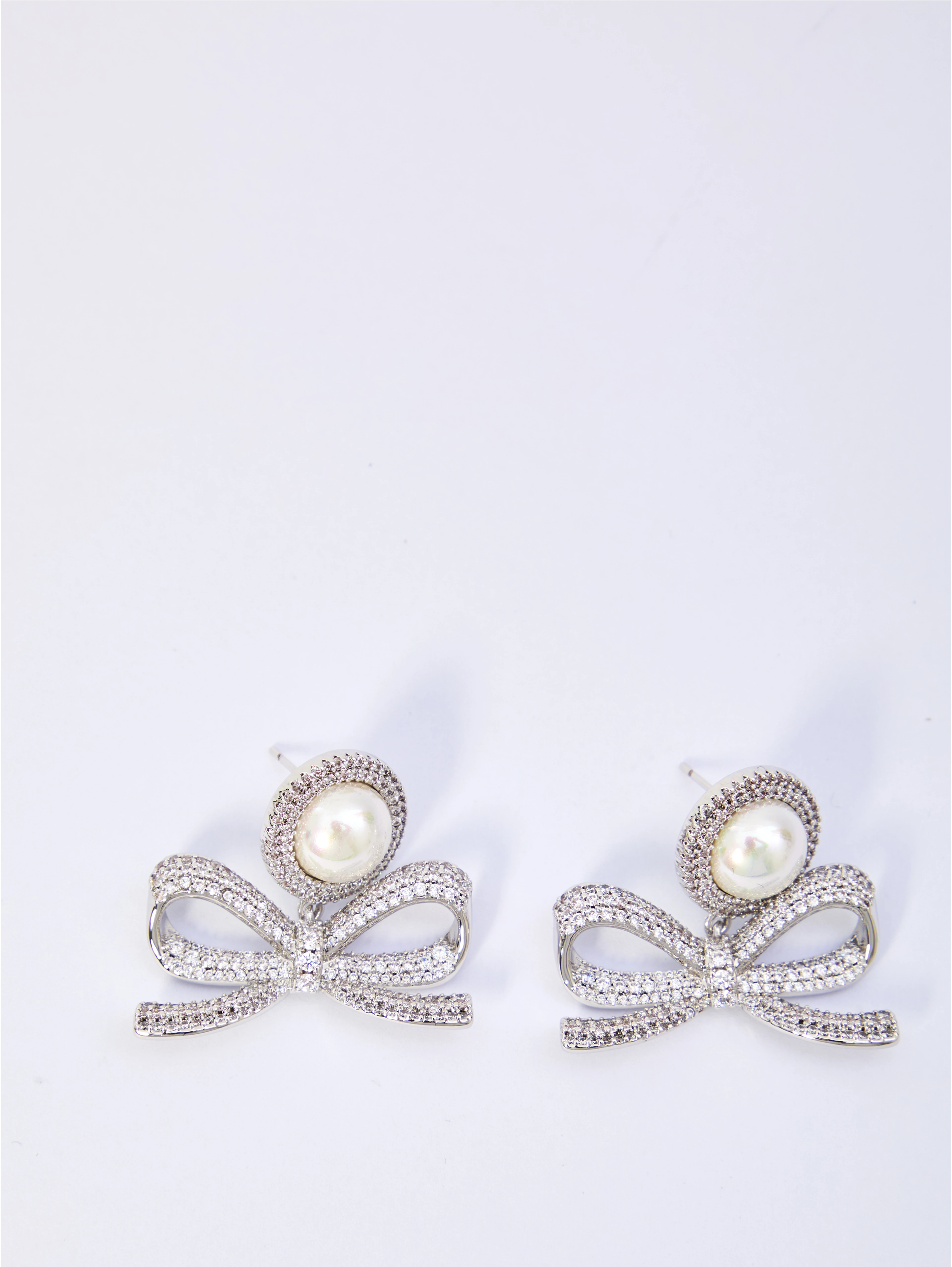 Pearl bow drop earrings