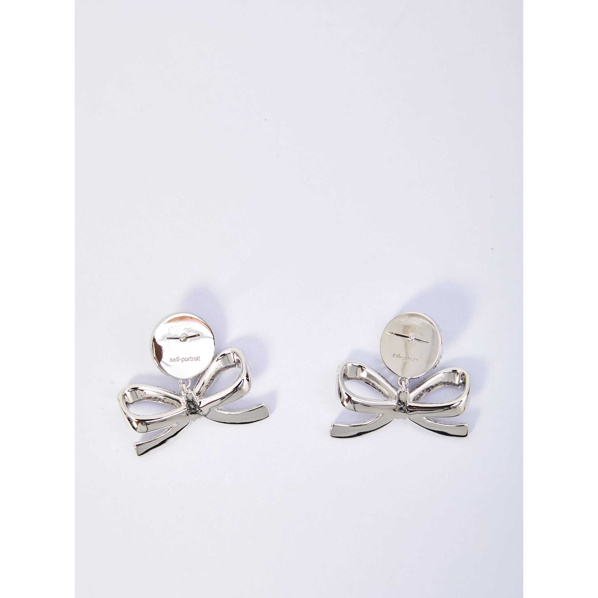 Pearl bow drop earrings