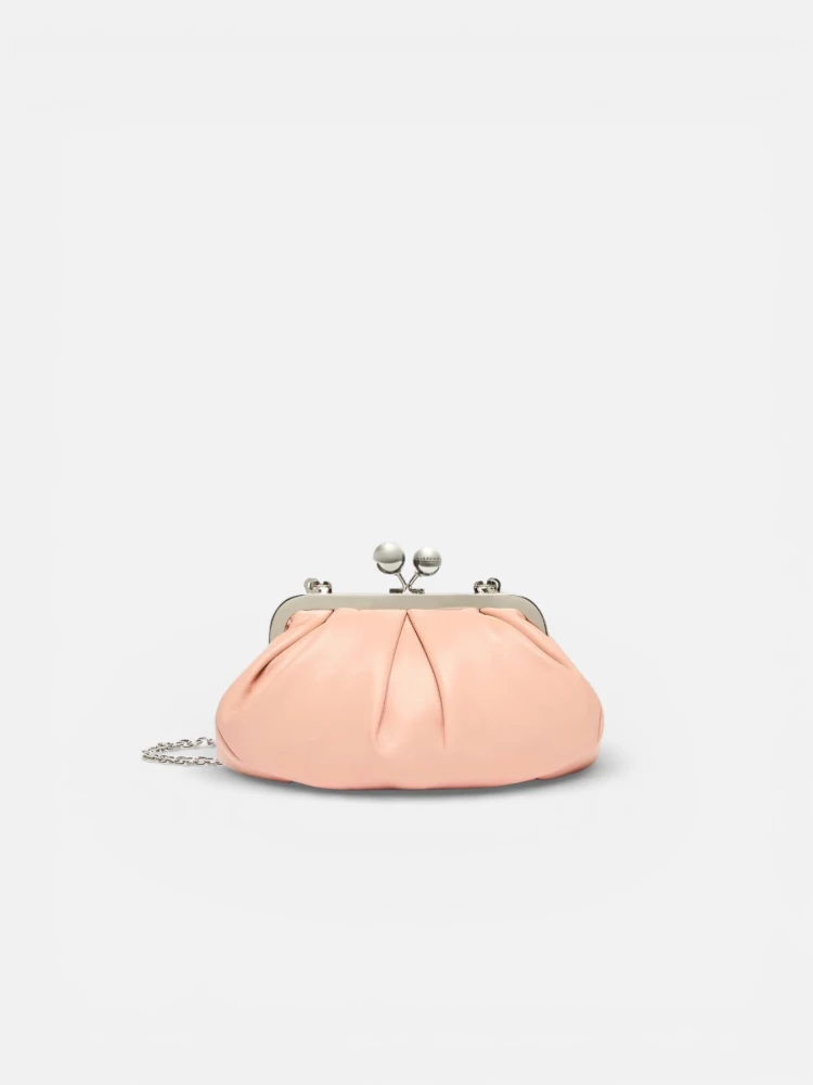 WEEKEND MAX MARA is accompanied by a handbag