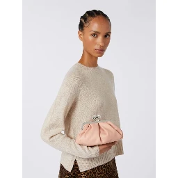 WEEKEND MAX MARA is accompanied by a handbag