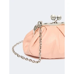 WEEKEND MAX MARA is accompanied by a handbag