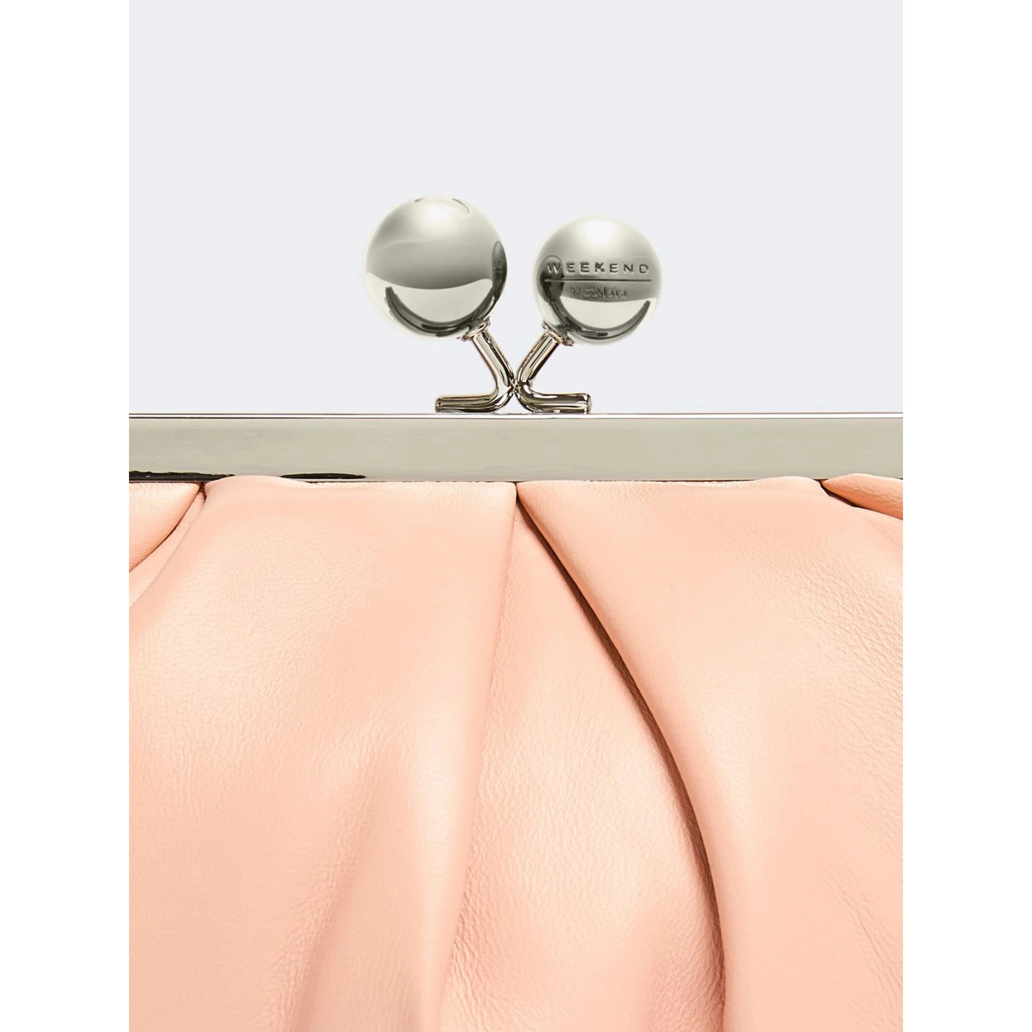 WEEKEND MAX MARA is accompanied by a handbag