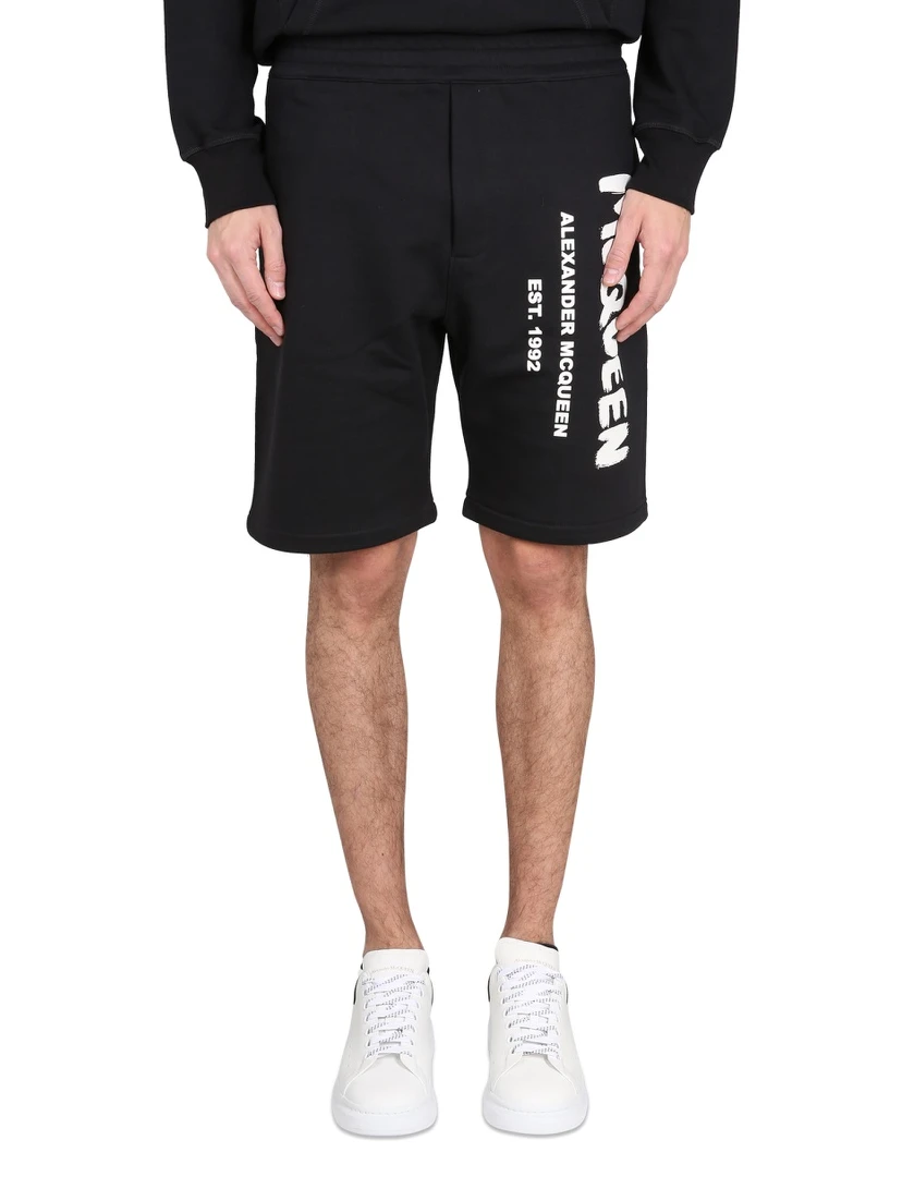 BERMUDA SHORTS WITH GRAFFITI LOGO PRINT