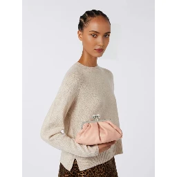 WEEKEND MAX MARA is accompanied by a handbag