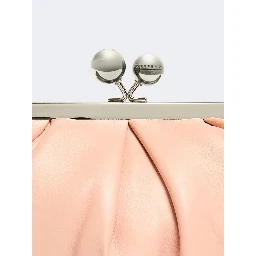 WEEKEND MAX MARA is accompanied by a handbag