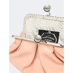 WEEKEND MAX MARA is accompanied by a handbag