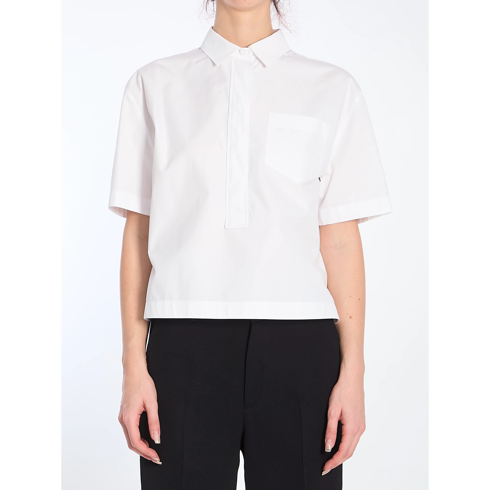 Shirt with embossed logo