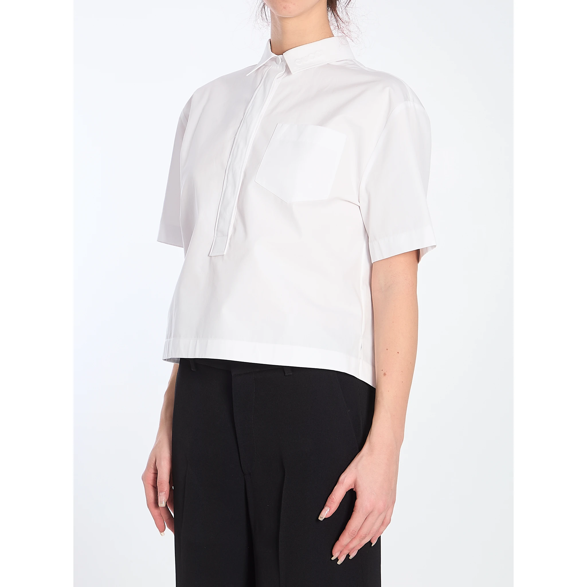 Shirt with embossed logo