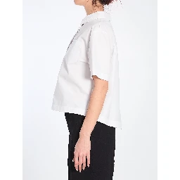 Shirt with embossed logo