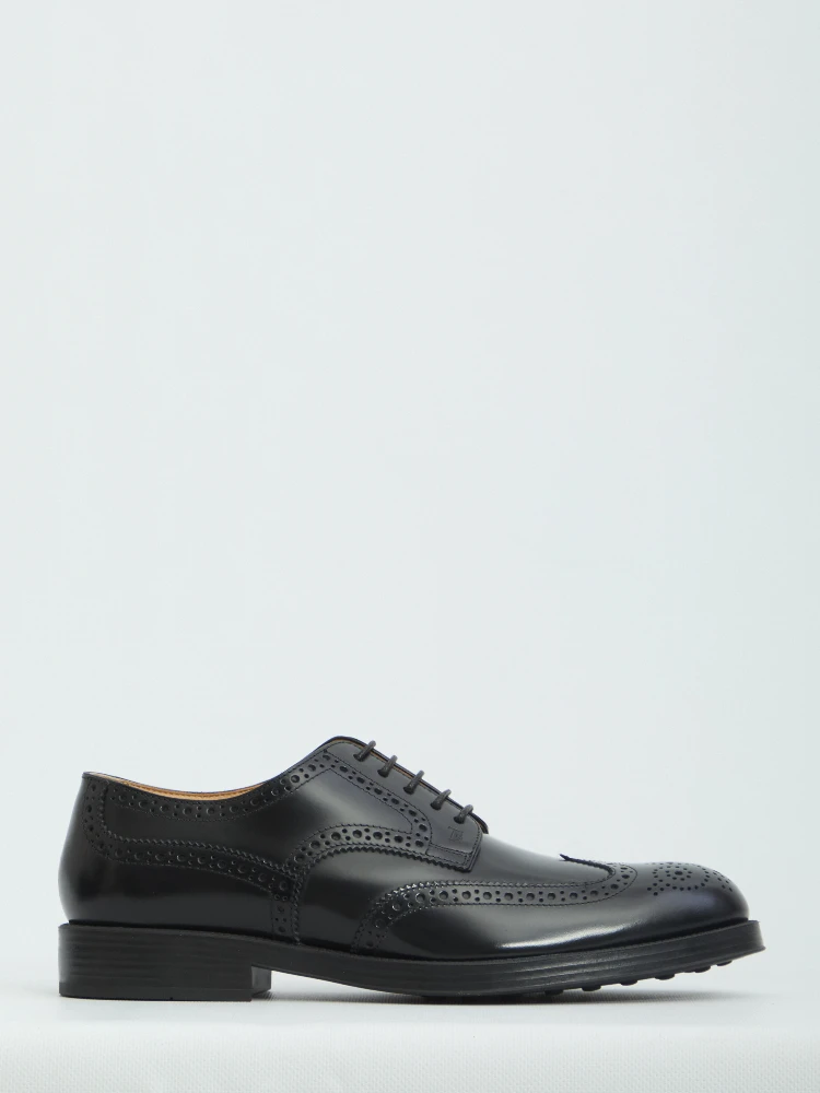 Laced up shoes with perforations