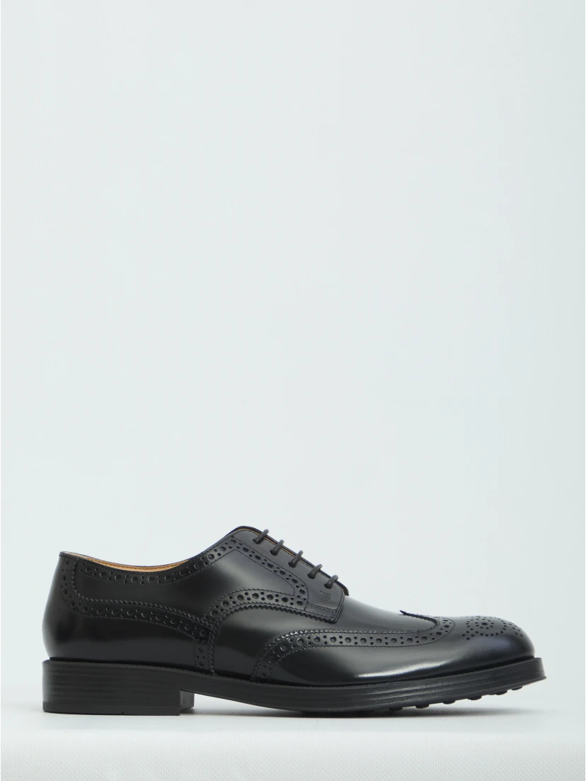 Laced up shoes with perforations
