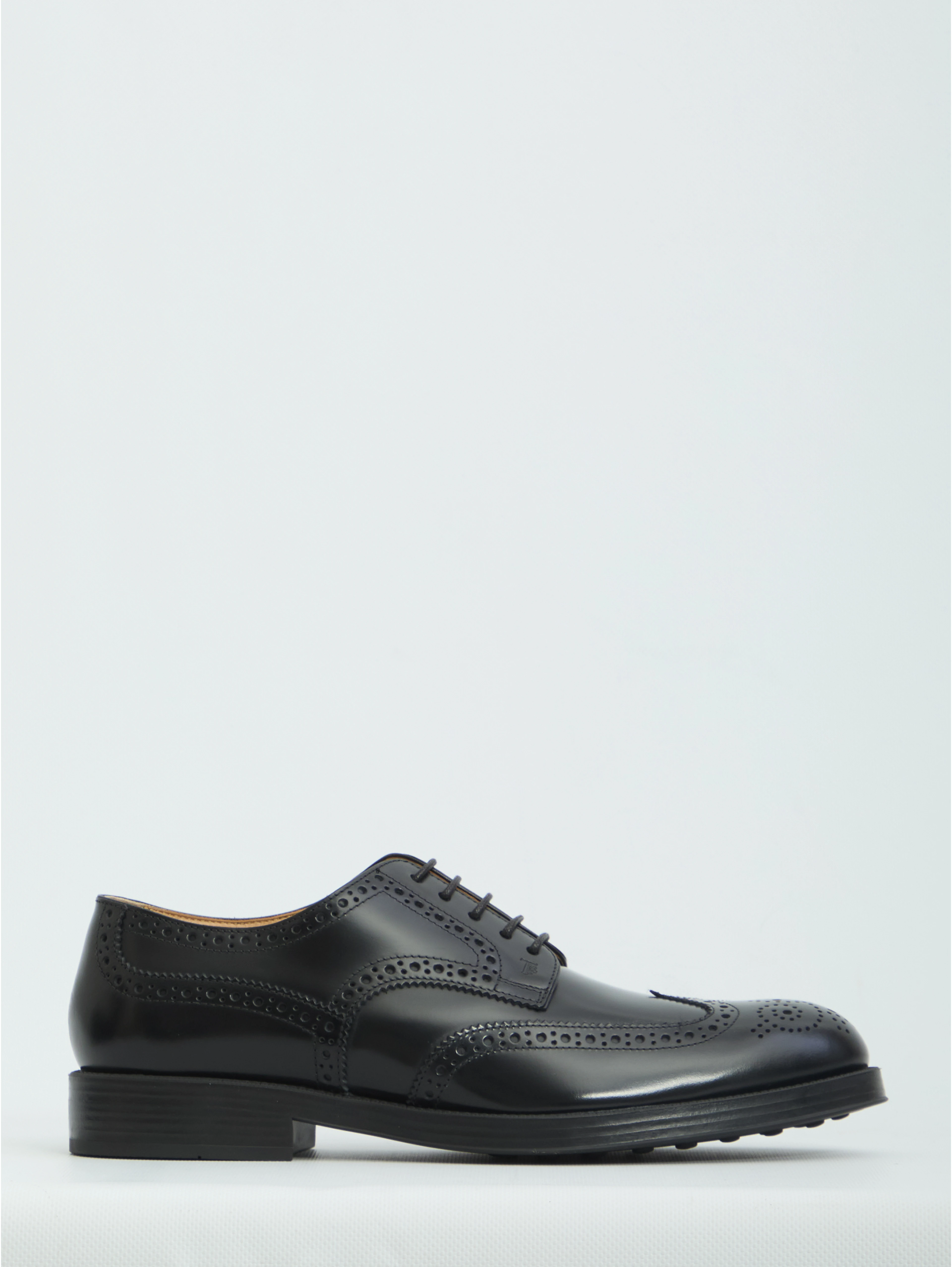 Laced up shoes with perforations