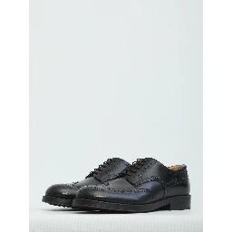 Laced up shoes with perforations