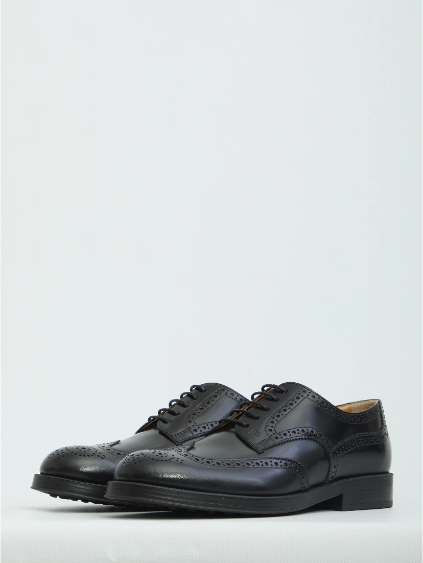 Laced up shoes with perforations