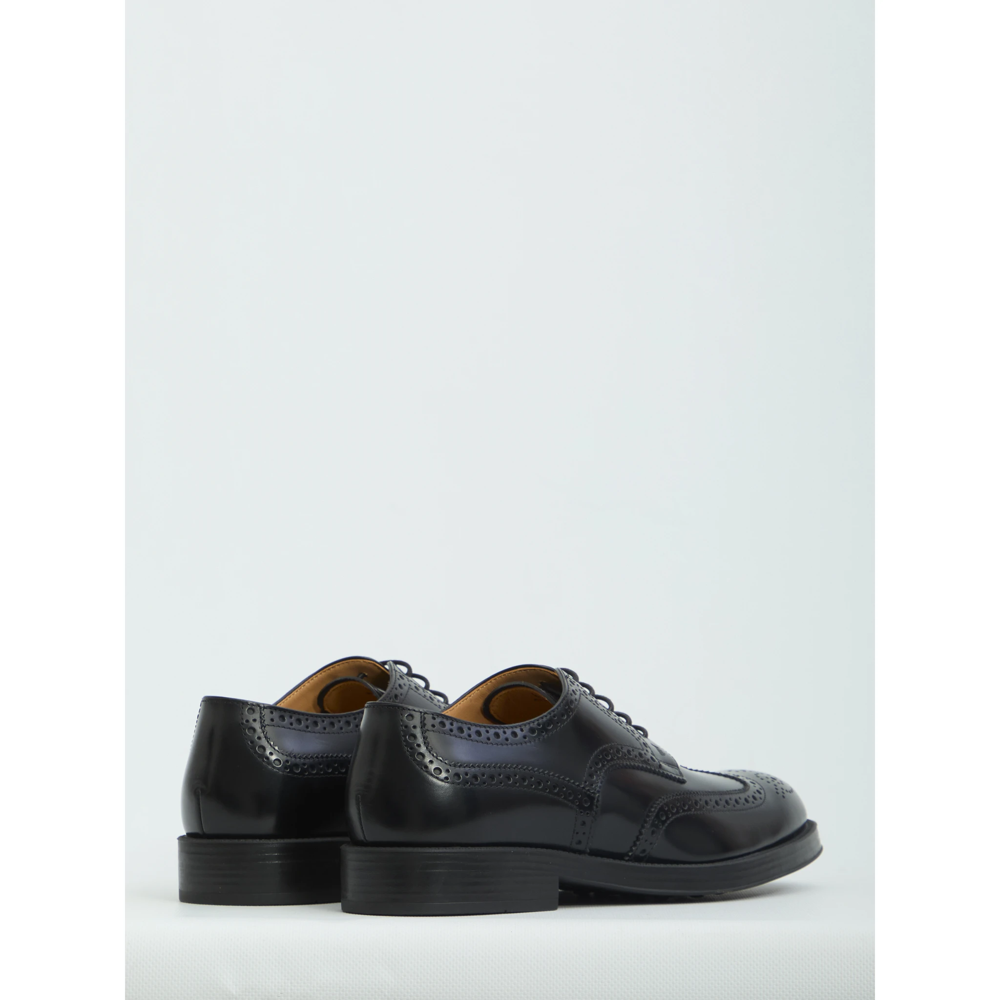 Laced up shoes with perforations