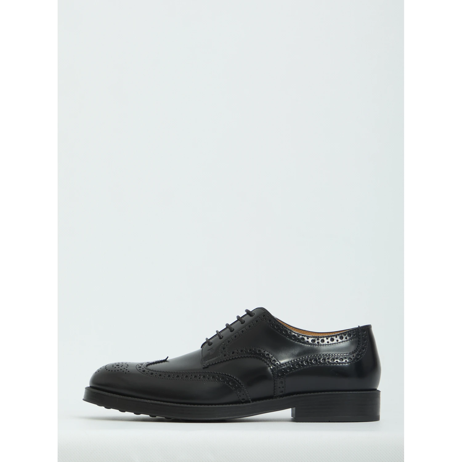 Laced up shoes with perforations