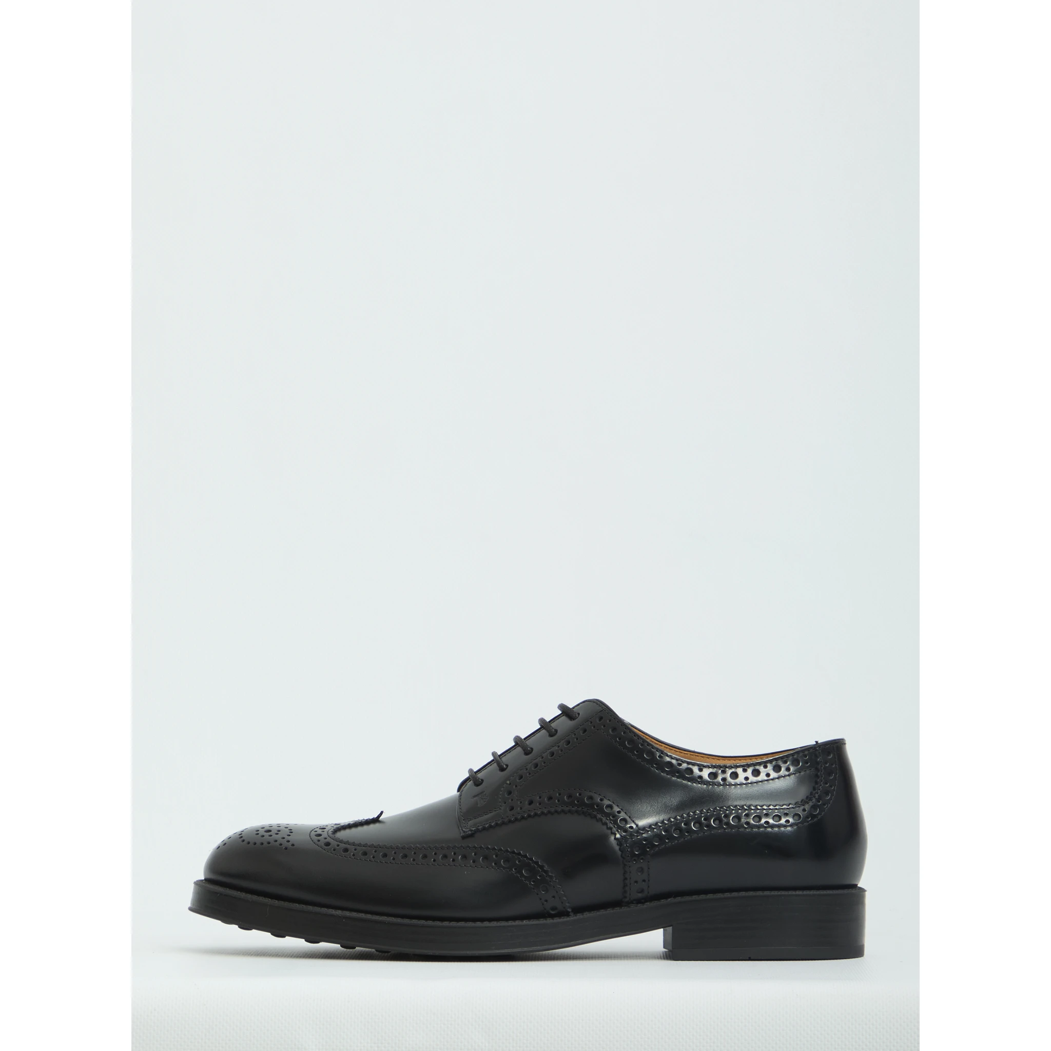 Laced up shoes with perforations