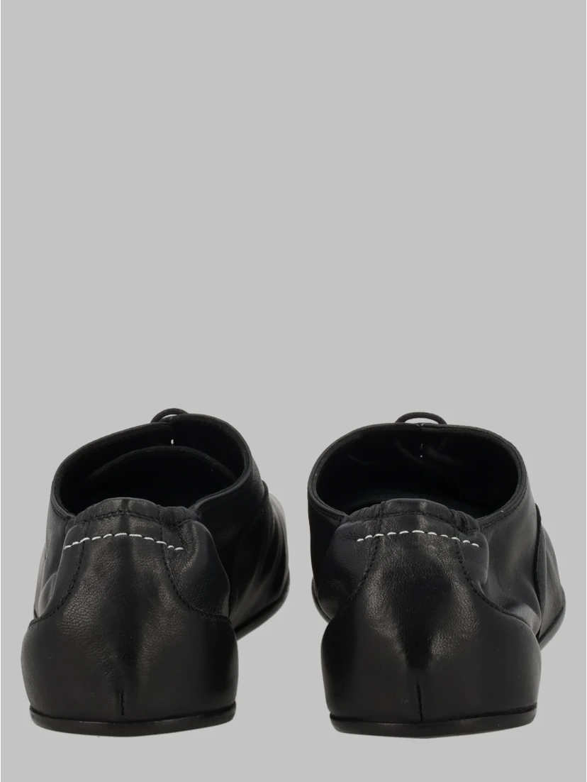 STRINGATA IN PELLE