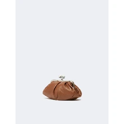 WEEKEND MAX MARA is accompanied by a handbag