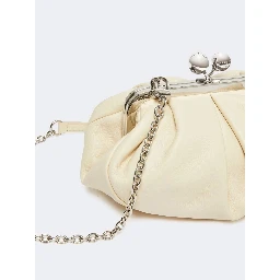 WEEKEND MAX MARA is accompanied by a handbag