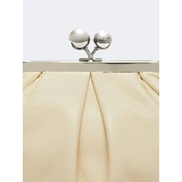WEEKEND MAX MARA is accompanied by a handbag