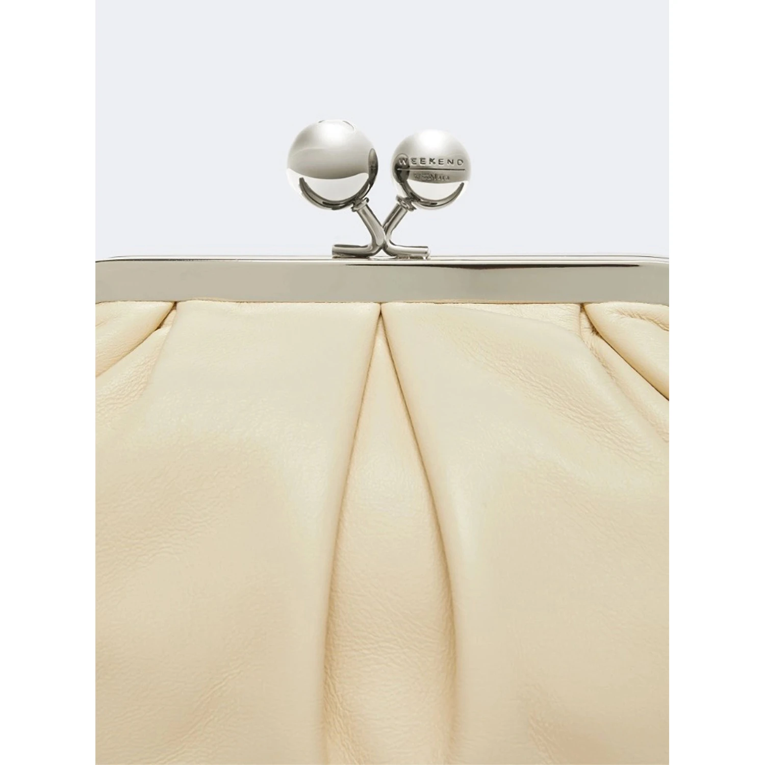 WEEKEND MAX MARA is accompanied by a handbag