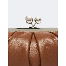 WEEKEND MAX MARA is accompanied by a handbag