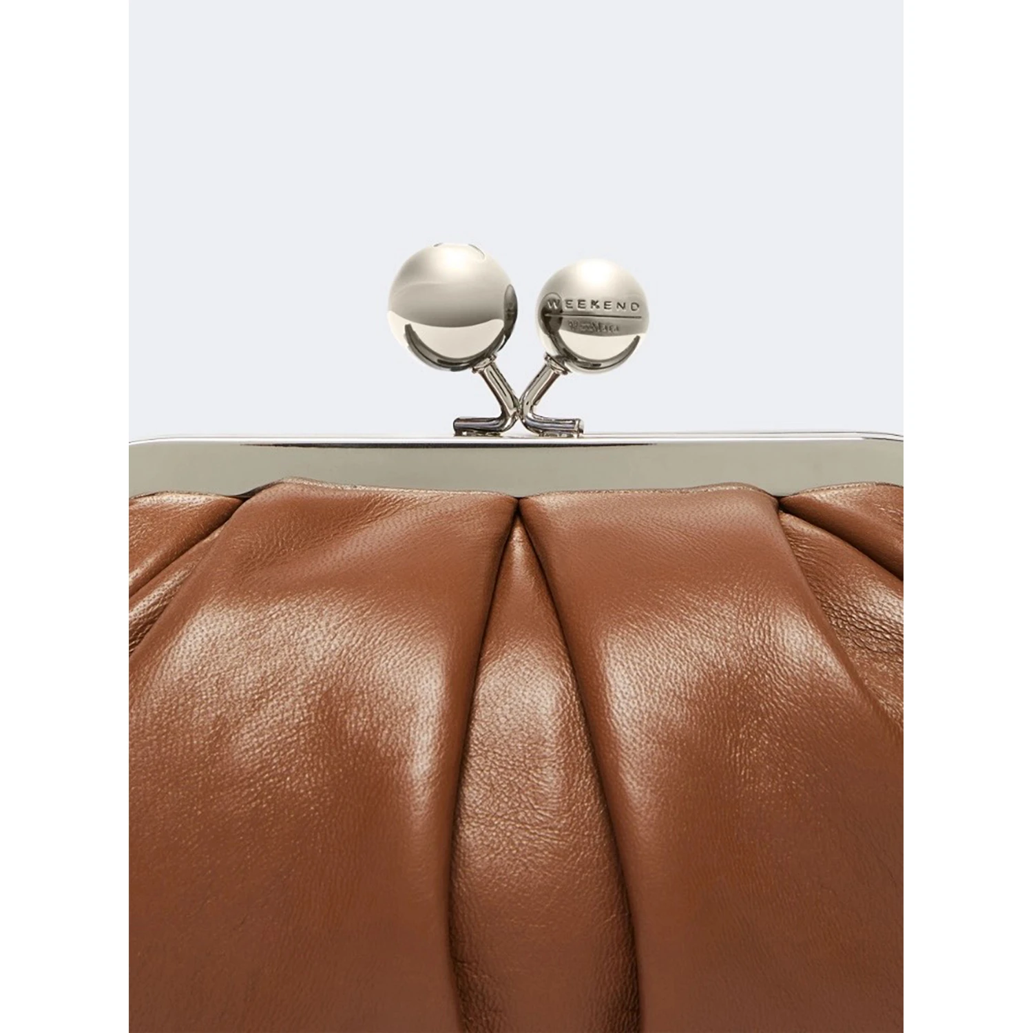 WEEKEND MAX MARA is accompanied by a handbag