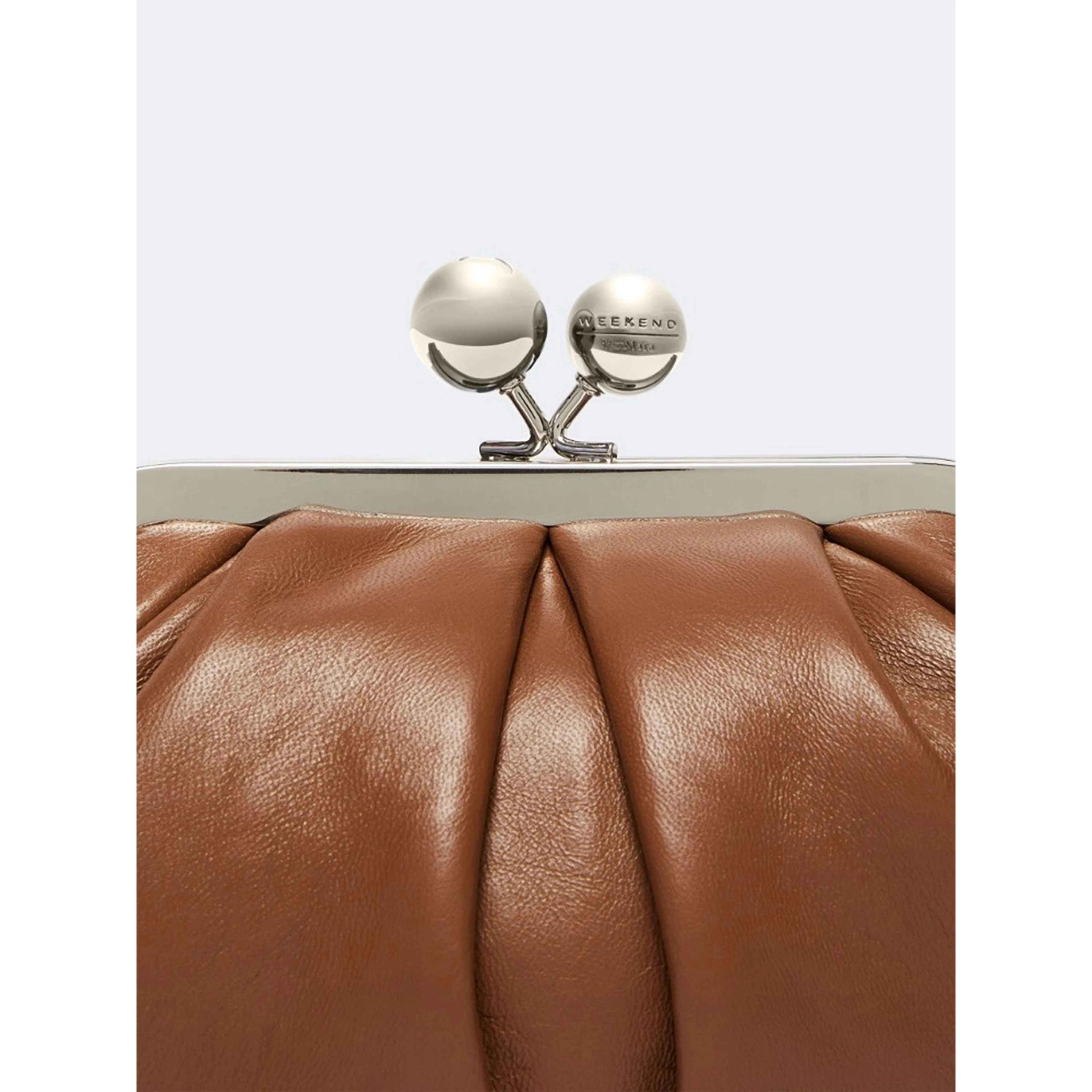 WEEKEND MAX MARA is accompanied by a handbag