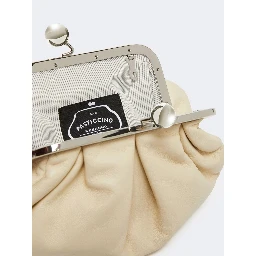 WEEKEND MAX MARA is accompanied by a handbag