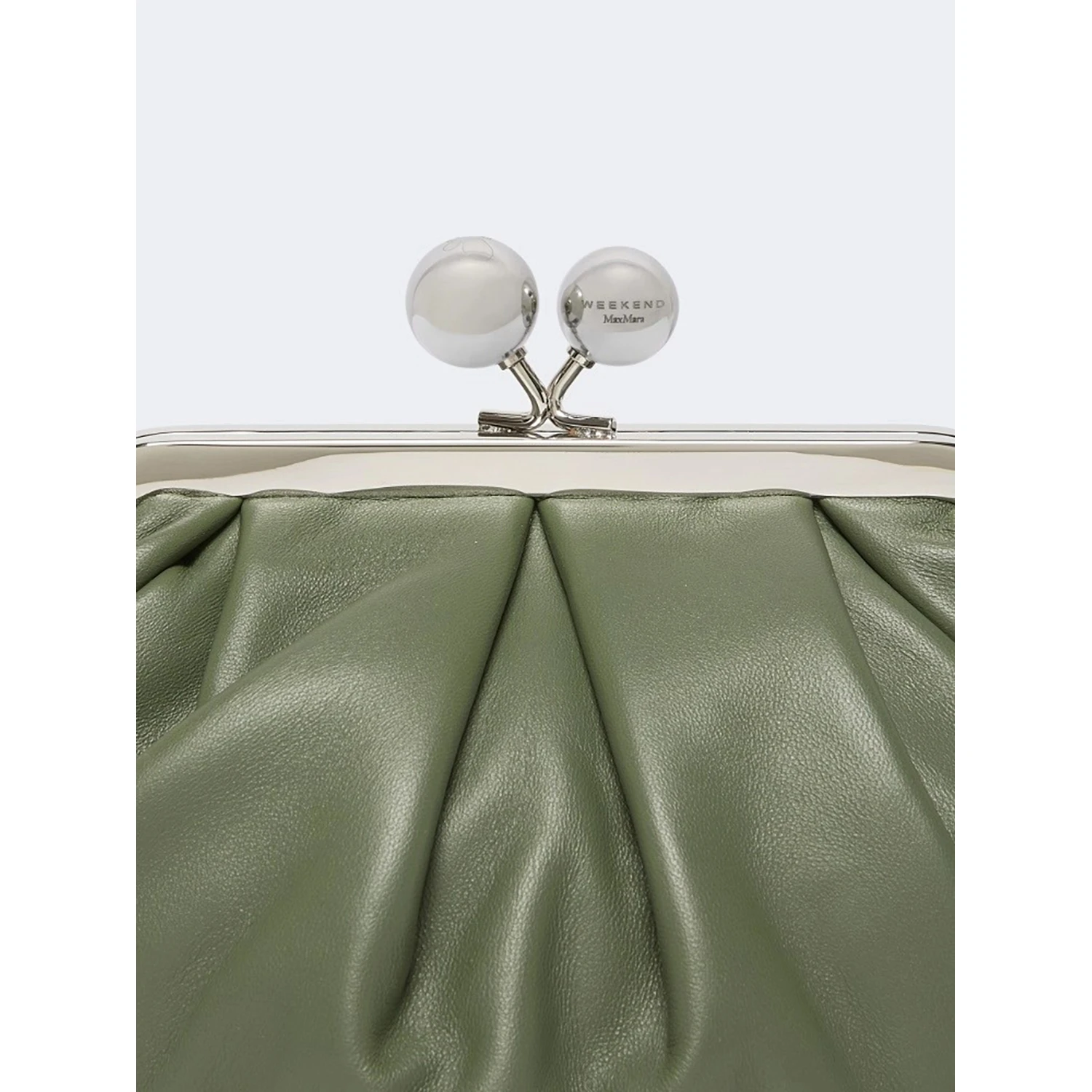 WEEKEND MAX MARA is accompanied by a handbag