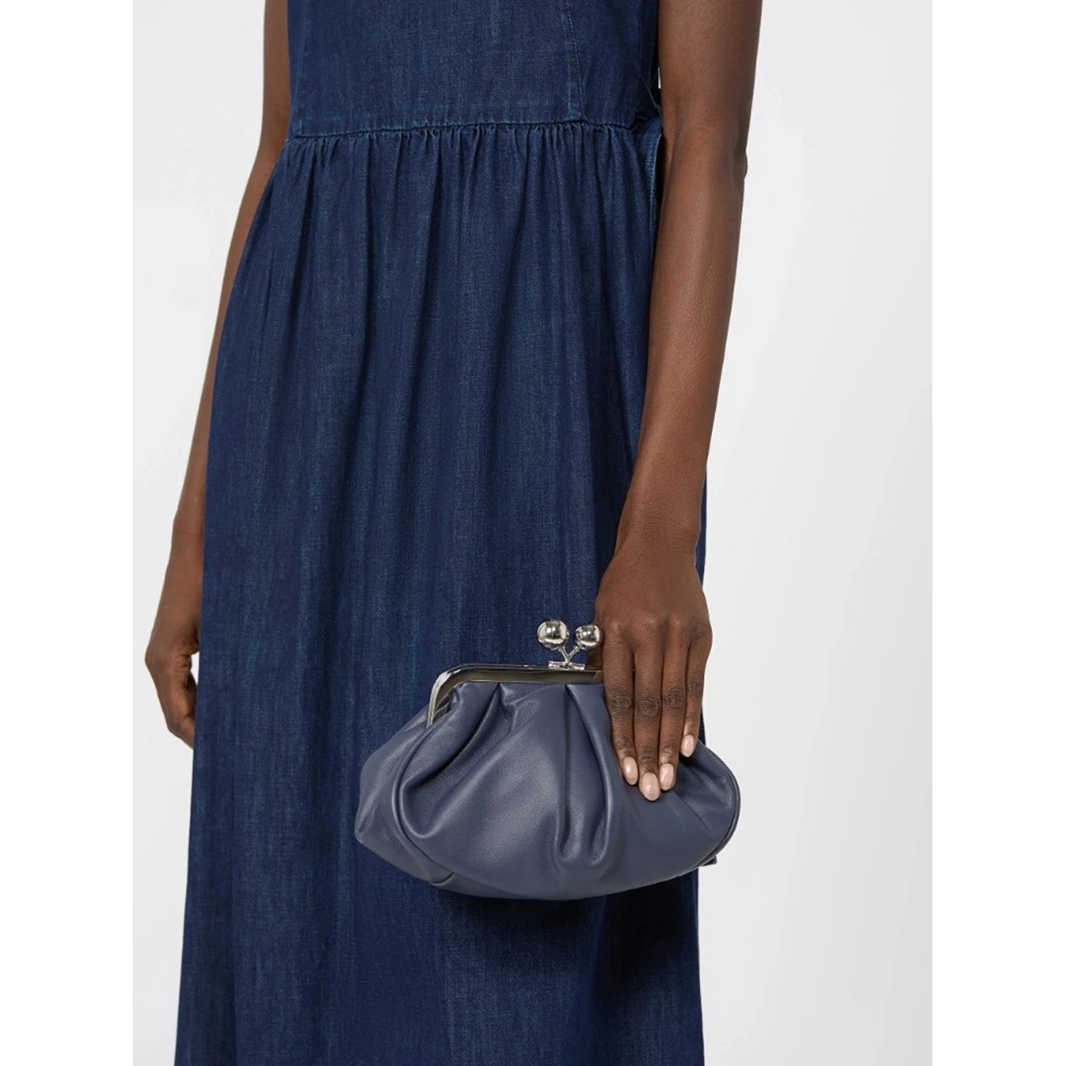 WEEKEND MAX MARA is accompanied by a handbag