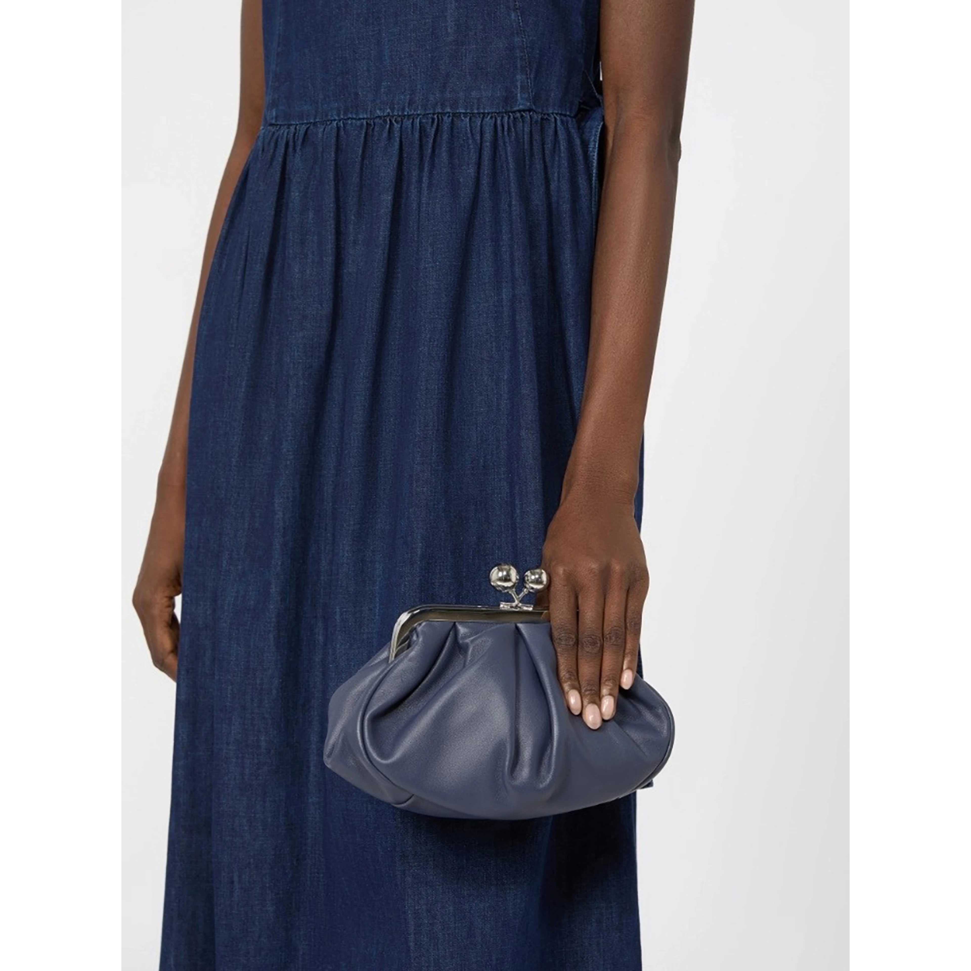 WEEKEND MAX MARA is accompanied by a handbag