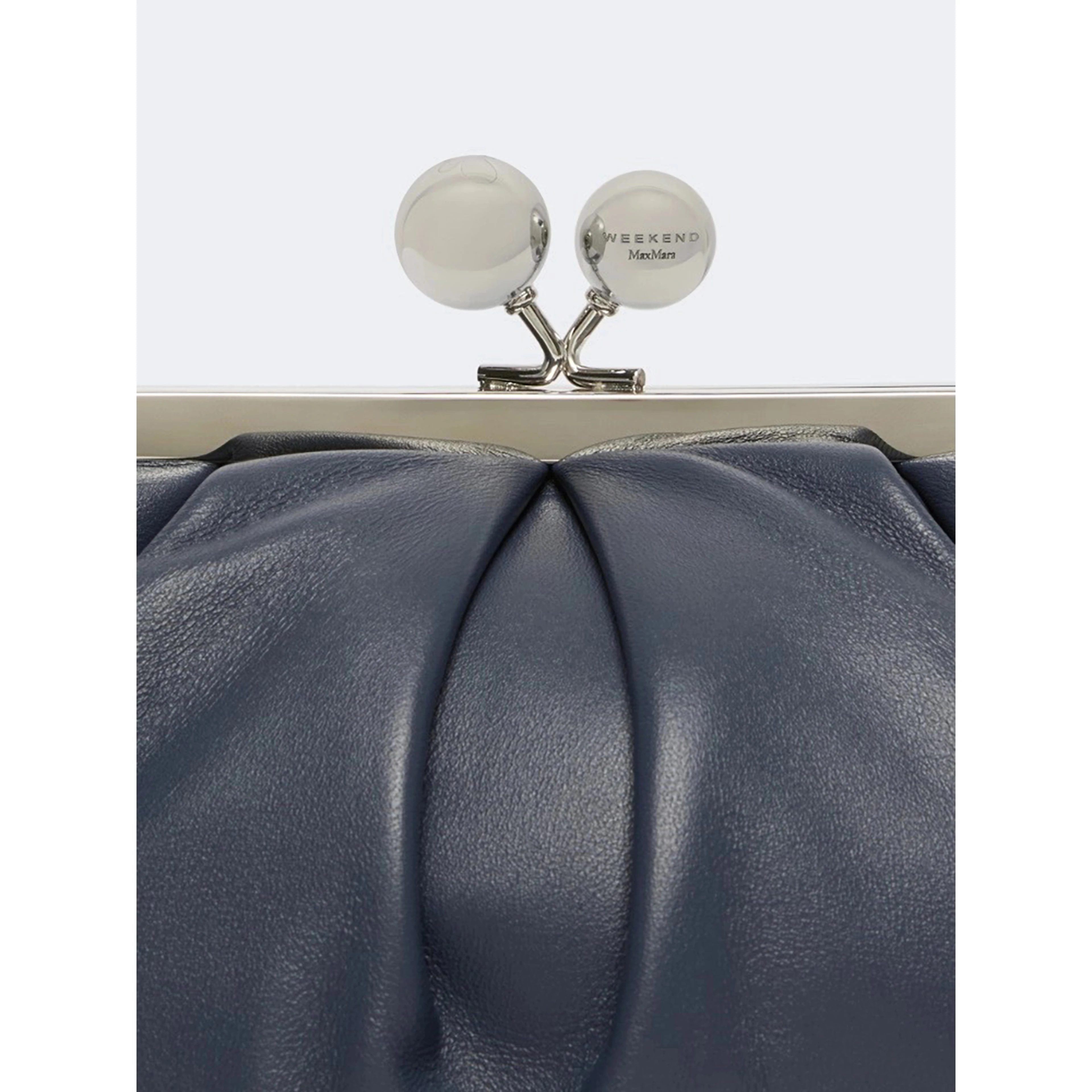 WEEKEND MAX MARA is accompanied by a handbag