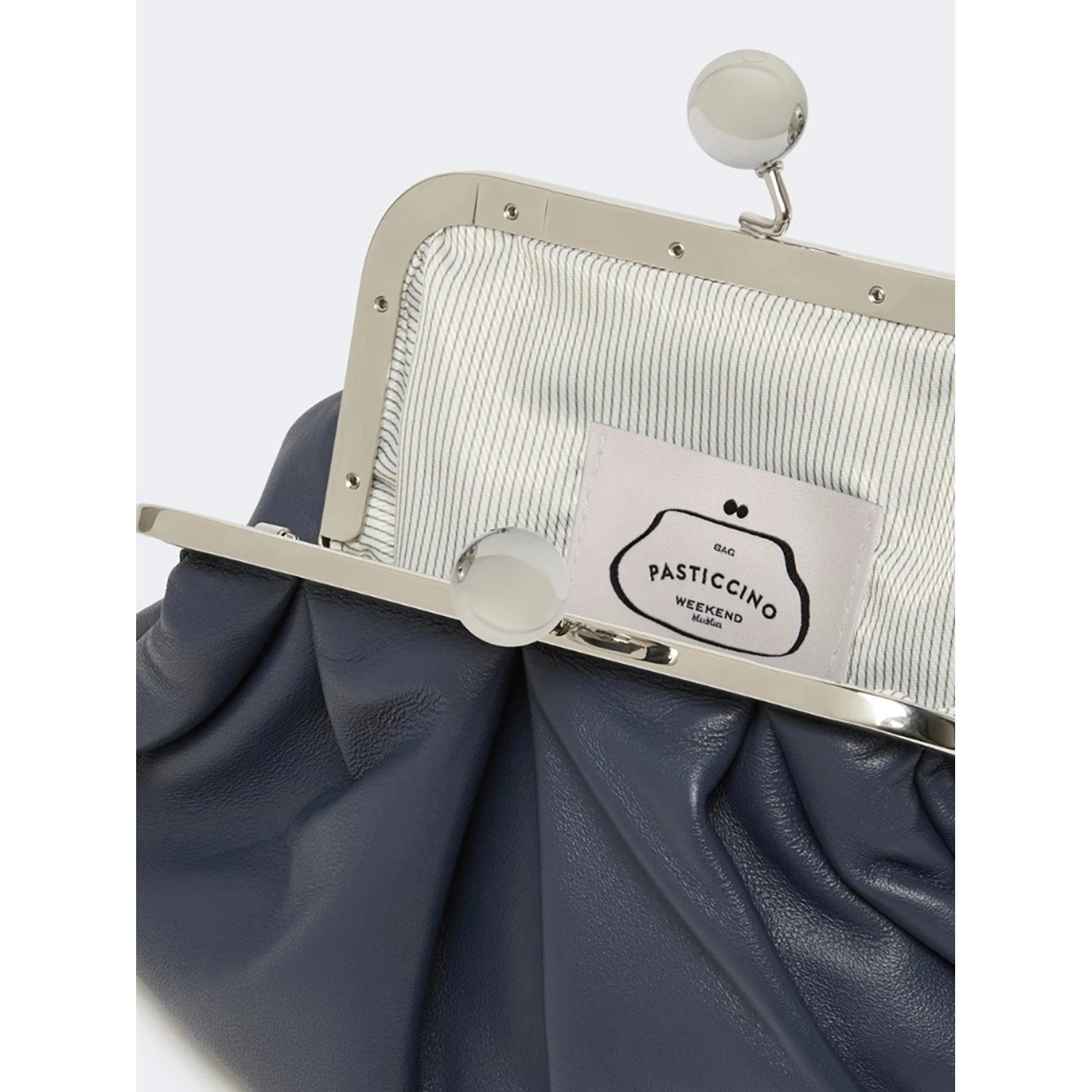 WEEKEND MAX MARA is accompanied by a handbag
