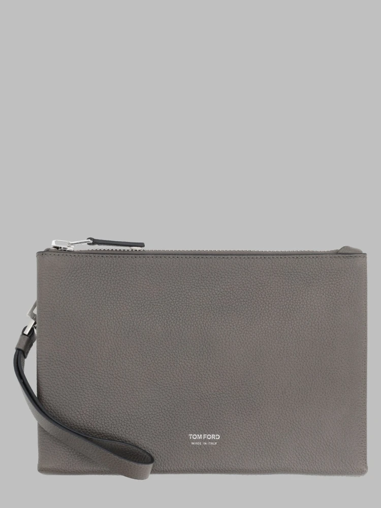 POUCHETTE MINIMAL SOTTILE IN PELLE FIORE CON CINTURINO DA POLSO
