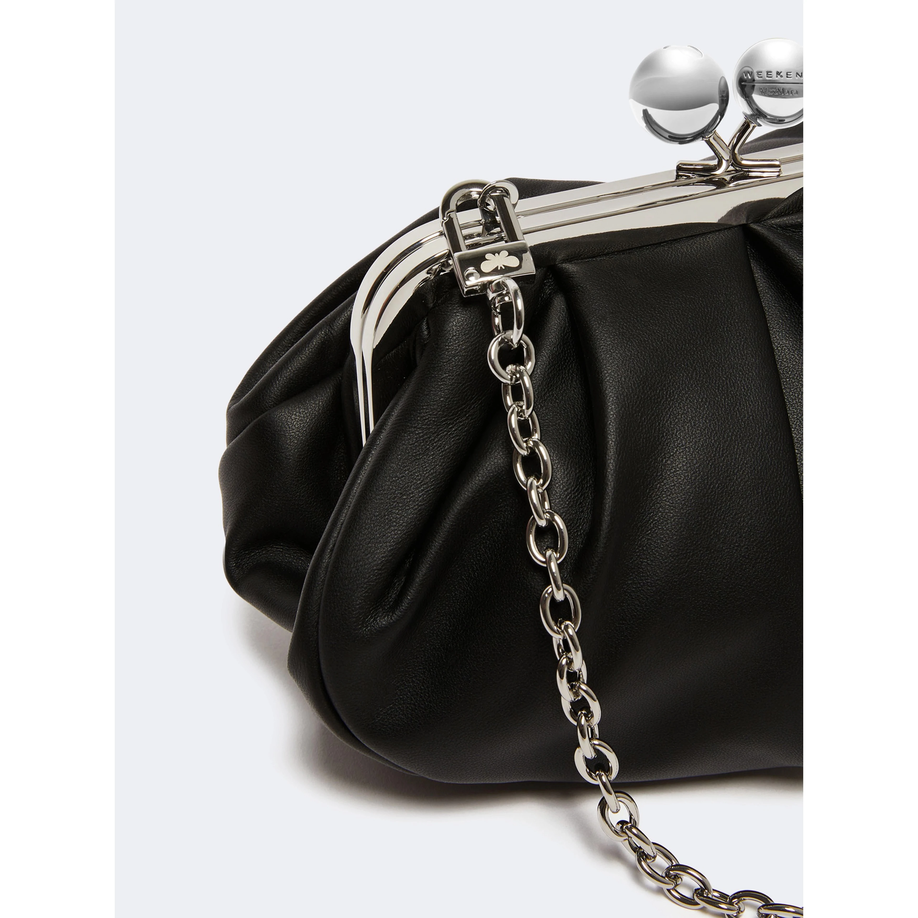 WEEKEND MAX MARA is accompanied by a handbag
