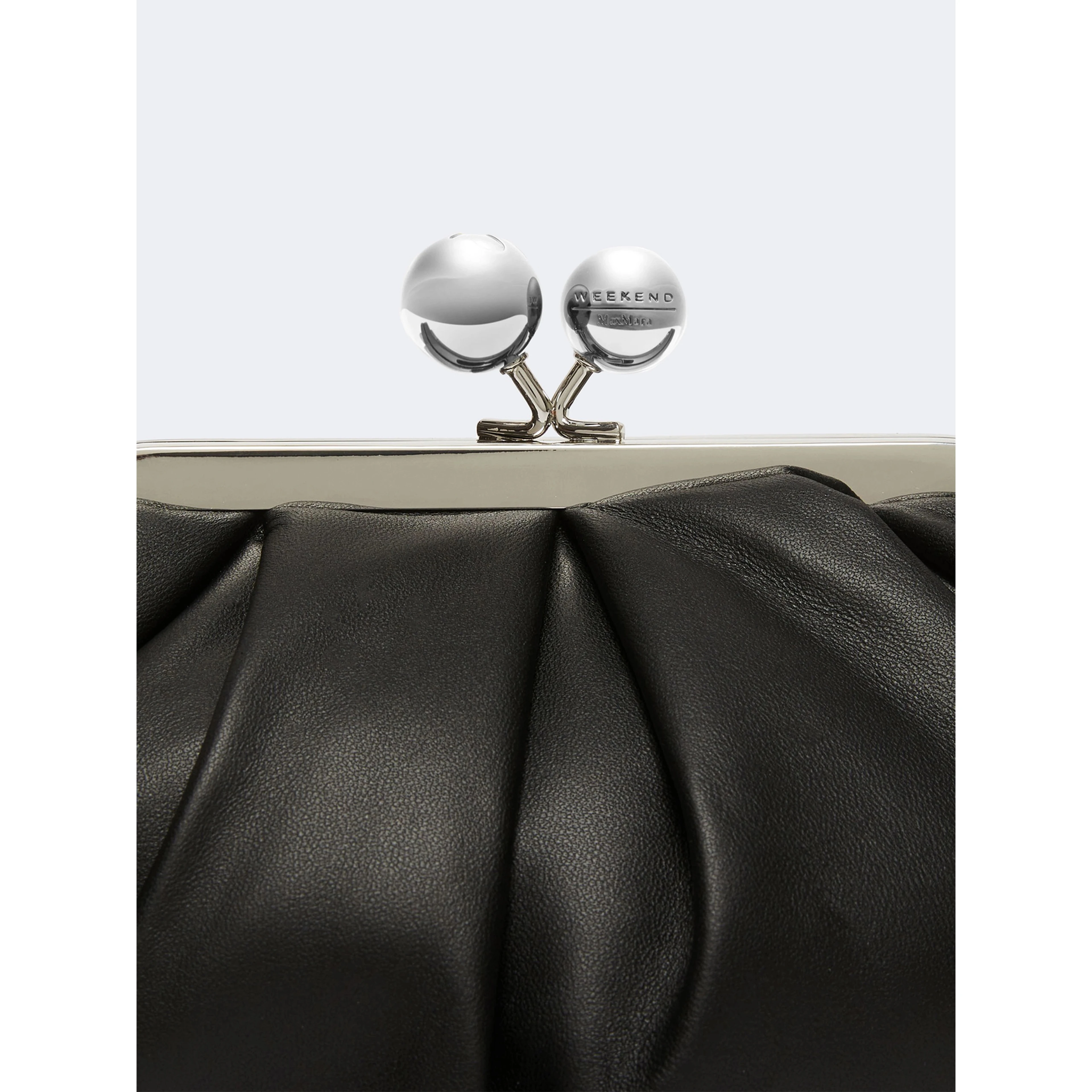 WEEKEND MAX MARA is accompanied by a handbag