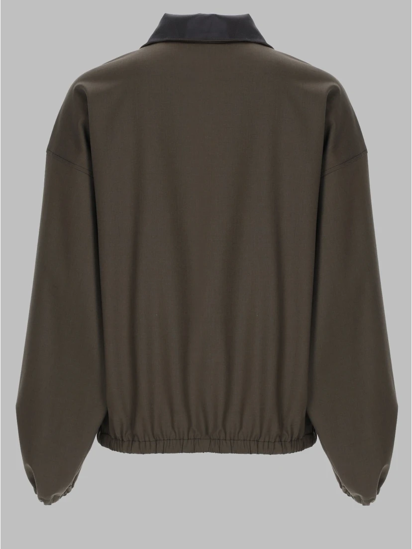 GIACCA CON ZIP A TRE QUARTI