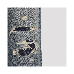 DISTRESSED DENIM TROUSERS