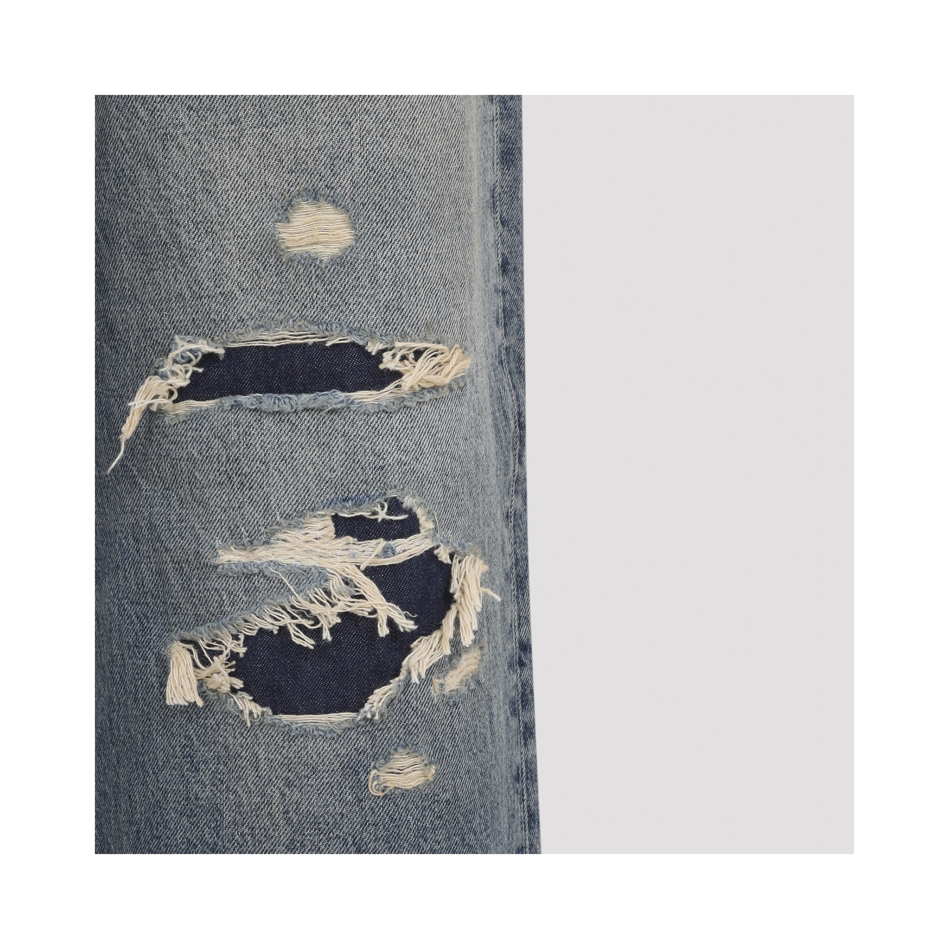 DISTRESSED DENIM TROUSERS