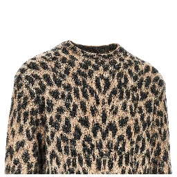 Knitted sweater with spotted motif