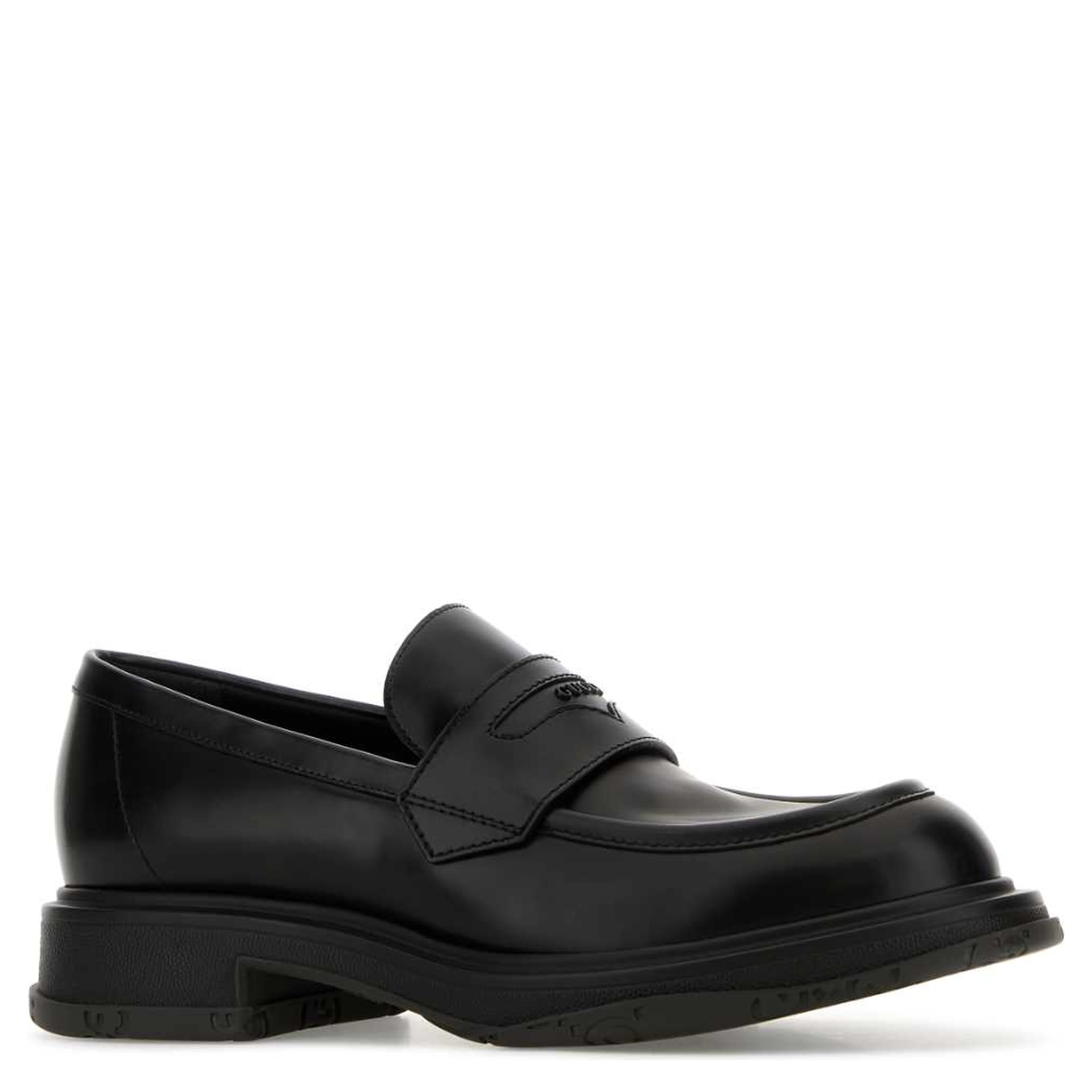 LEATHER UPPER AND RUBBER SOLE MOCCASIN