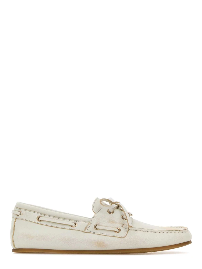 LEATHER UPPER AND RUBBER SOLE MOCCASIN
