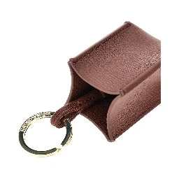 Grained leather charm with logo plate