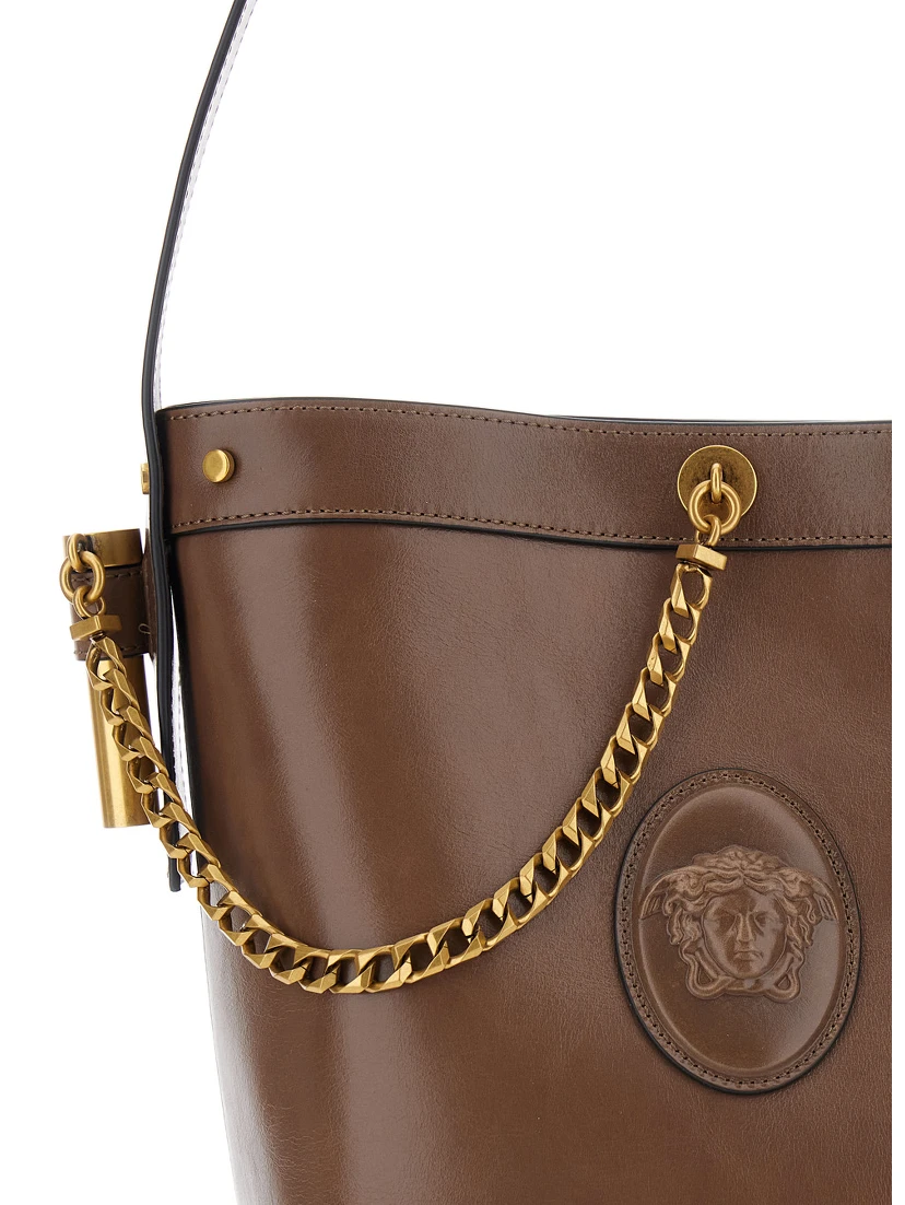Brown Shoulder bag with chain strap and Medusa Head on the front in leather for women