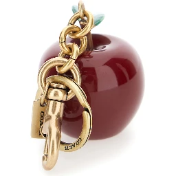 gold and red Keychain with apple shape and embossed logo in metal for women